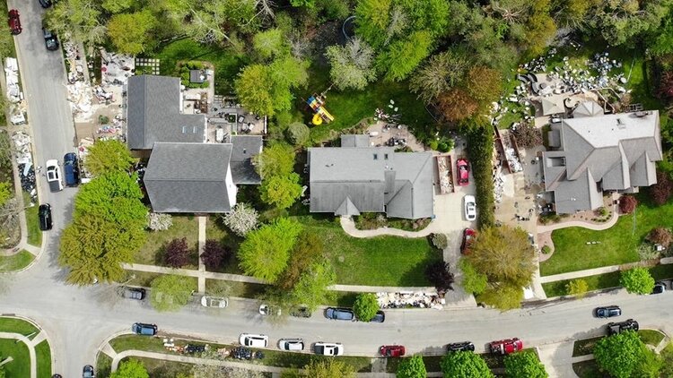 An aerial view of homes as they remove damaged items or lay them out to dry. (PC: Ben Tierney)