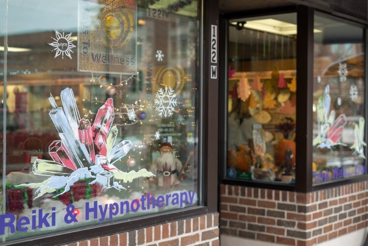 Crystals adorn the windows of Ways to Wellness