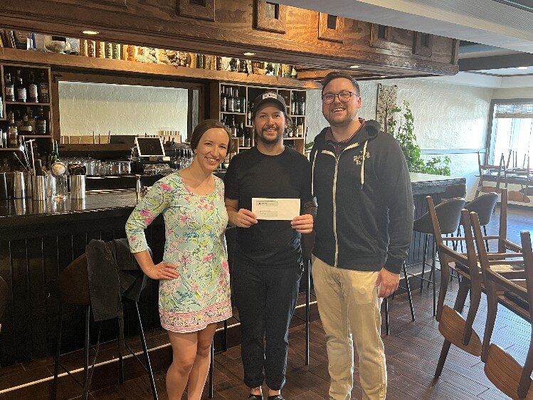 MYPros check presentation to Evan Sumrell of Aster.