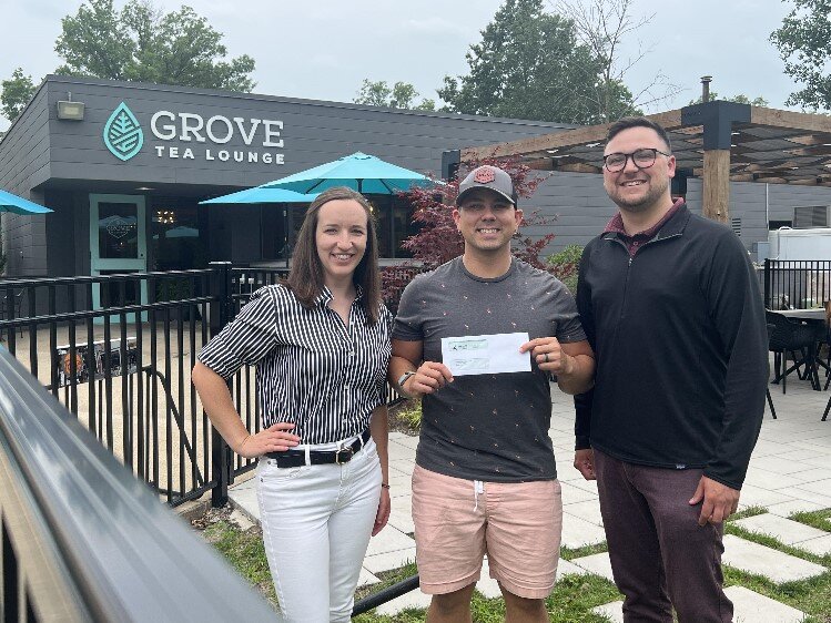 MYPros check presentation to Patrick McElgunn of Grove Tea Lounge.