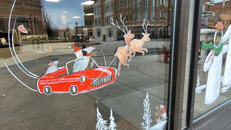 Downtown Midland window art by the Brush Monkeys.