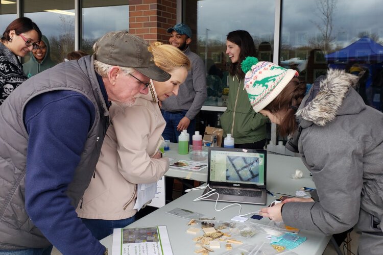 Community members gather for Earth Day celebration.