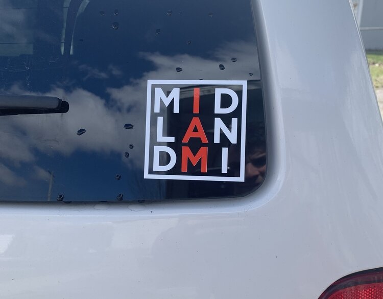 A window decal of Red Threads’ “I am Midland” campaign. (PC: Red Threads)