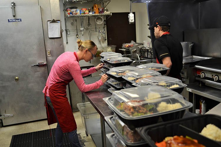 Staff at Shier’s Deli prepares 150 ReGrow meals each week. The program has allowed the two employees to keep their jobs.