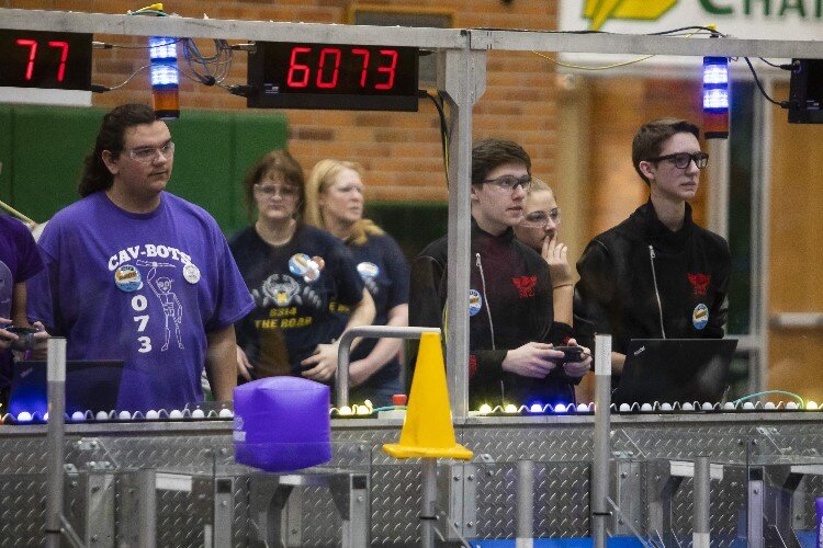 Team members of the "Rogue Robots" of Midland, right, compete in a match during the FIRST.