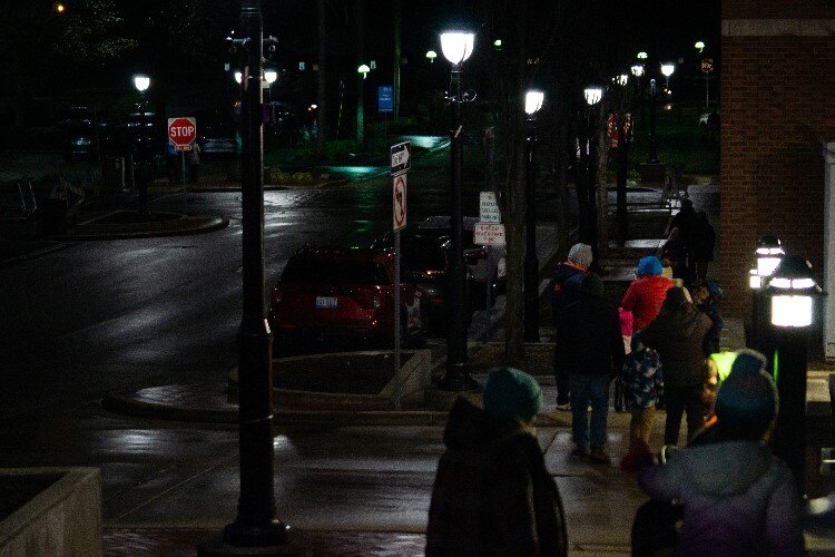 Eager families bustle toward the Tridge, where Santa and Mrs. Claus will be arriving.