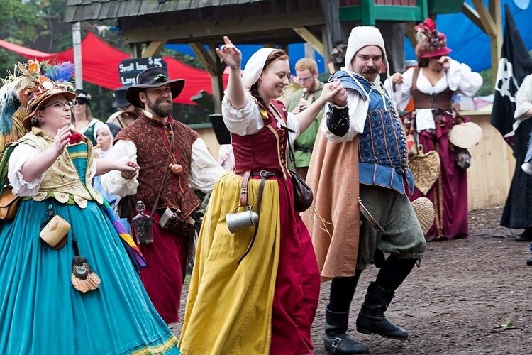 Archer, in the blue skirt, turned her love of fiber arts into a job as the costume director for the Michigan Renaissance Festival.