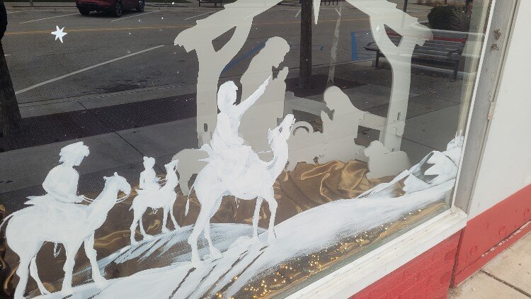 Downtown Midland window art by the Brush Monkeys.