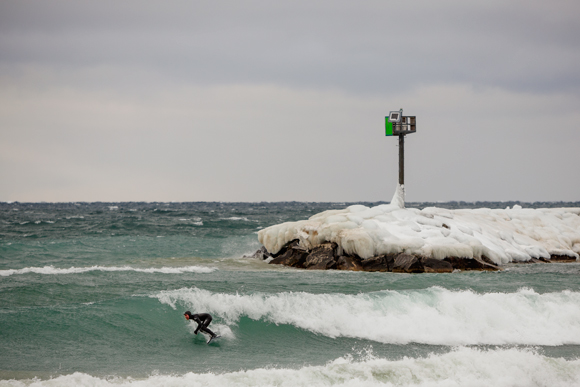 Surfer Nick Brown off of Leland in Lake Michigan.