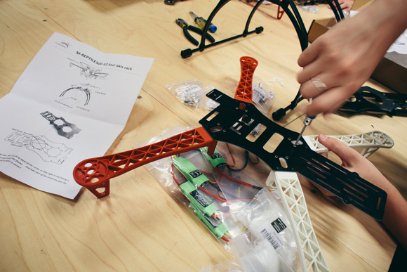 UAS I (Unmanned Ariel Systems I) students put together their hobby level quad rotor frames during class.