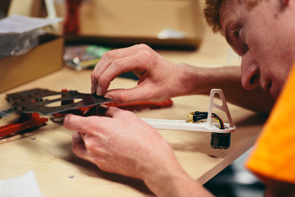 UAS I (Unmanned Ariel Systems I) students put together their hobby level quad rotor frames during class.