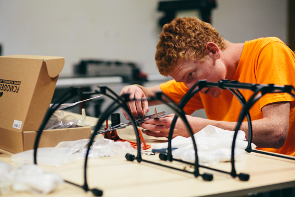 UAS I (Unmanned Ariel Systems I) students put together their hobby level quad rotor frames during class.