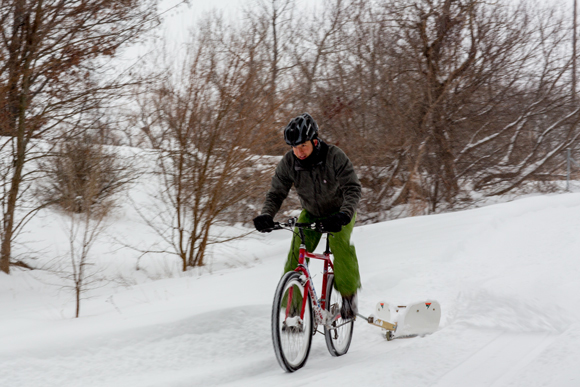 Ty Schmidt pulling the Peterson Bike Plow‏. / Beth Price