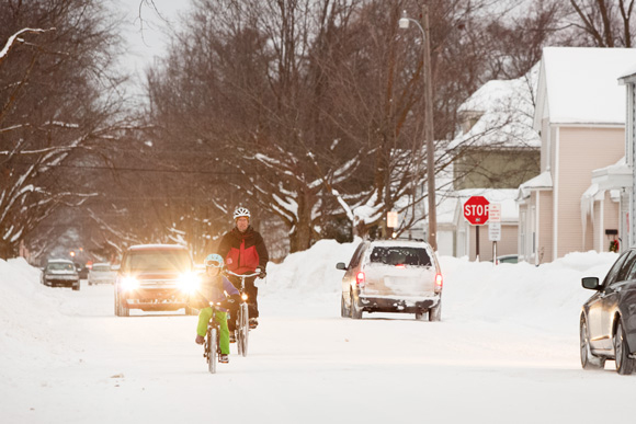 Amelia Werner bikes to school with her father Tim. / Beth Price