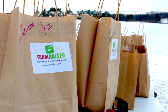 Bags full of FarmRaiser fund-raising goodies. / Christina Carson