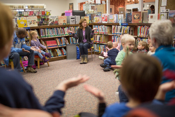 Allison Keessen leads children and parents in reading.