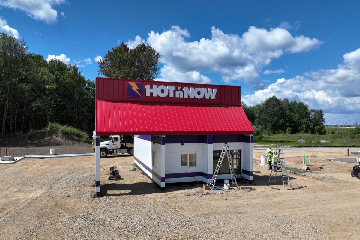 A modular Hot 'n Now arrived in Wayland by truck and placed down by crane.