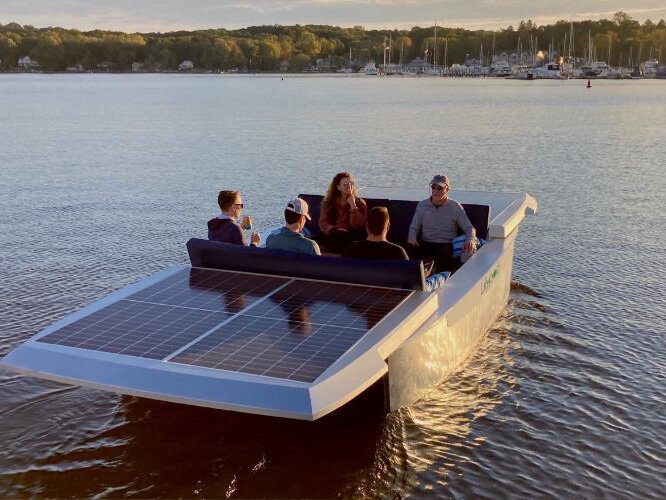 Boaters enjoy the solar-powered prototype on Lake Leelanau.