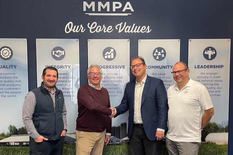 Officials from the Michigan Milk Producers Association and Dairy Distillery USA celebrate their new joint partnership, the Dairy Distillery Alliance.