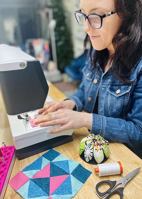 “I’d be the one sitting at the foot pedal while my mom was doing all of the [sewing] machine work,” says Cassie Harms. “As I got older I learned more from her, as well as local quilt shops and taking classes with my grandma."