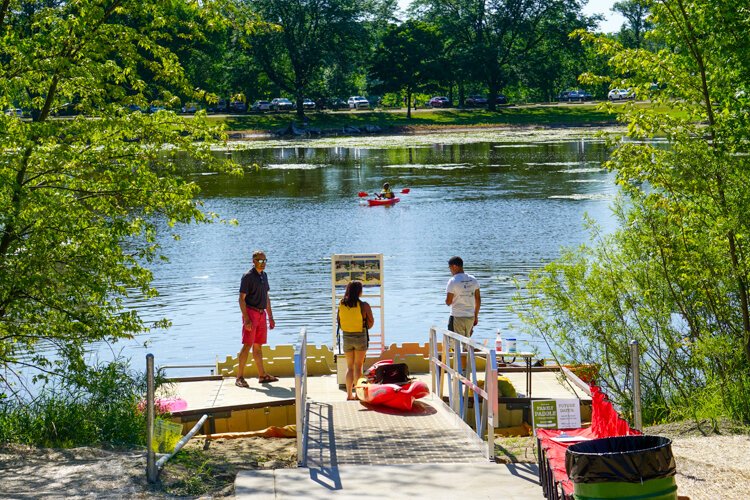City of GR's Parks Director David Marquordt (in red shorts) enjoys meeting folks in our parks. 