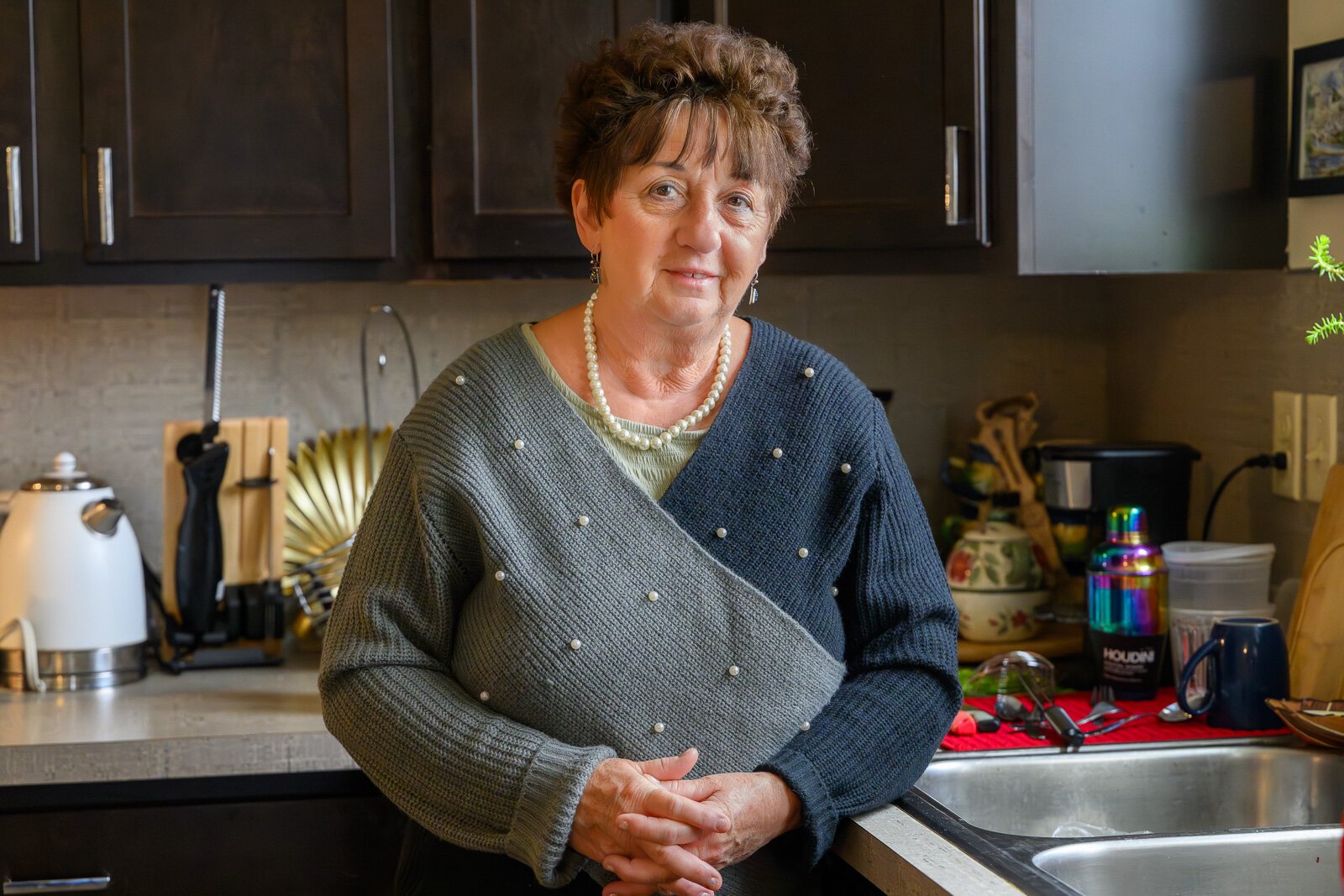 Maria Munteanu in her apartment at Hilltop View Apartments.