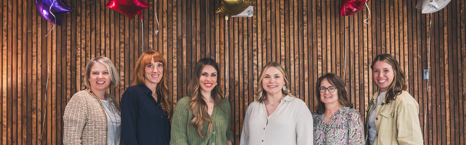 Jenny Silva, Niki Ardis, Hannah McNaughton, Paige Evans, Karen Watts, and Alex Wheeler at Metric Marketing's office in downtown Saline.