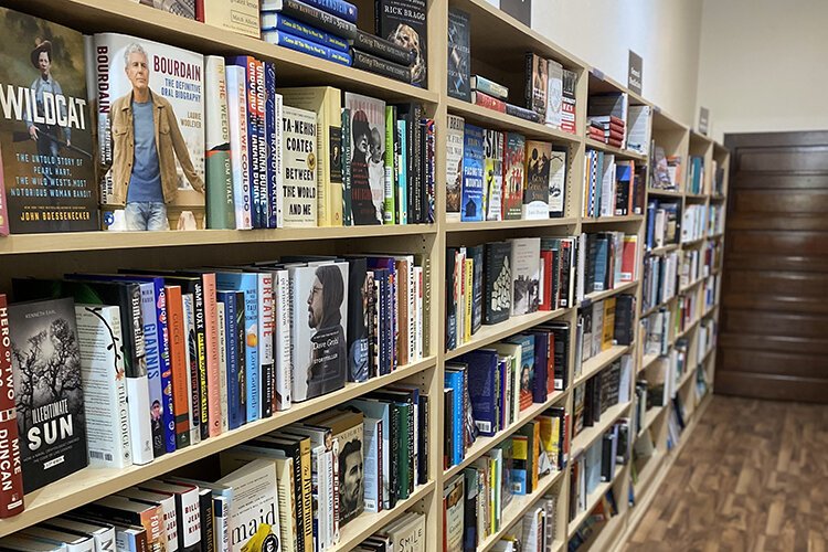 Owners of Sleepy Dog Books Riley and Jennifer Justis curate the selection of the bookstore with the community's interests in books that they would like to read.