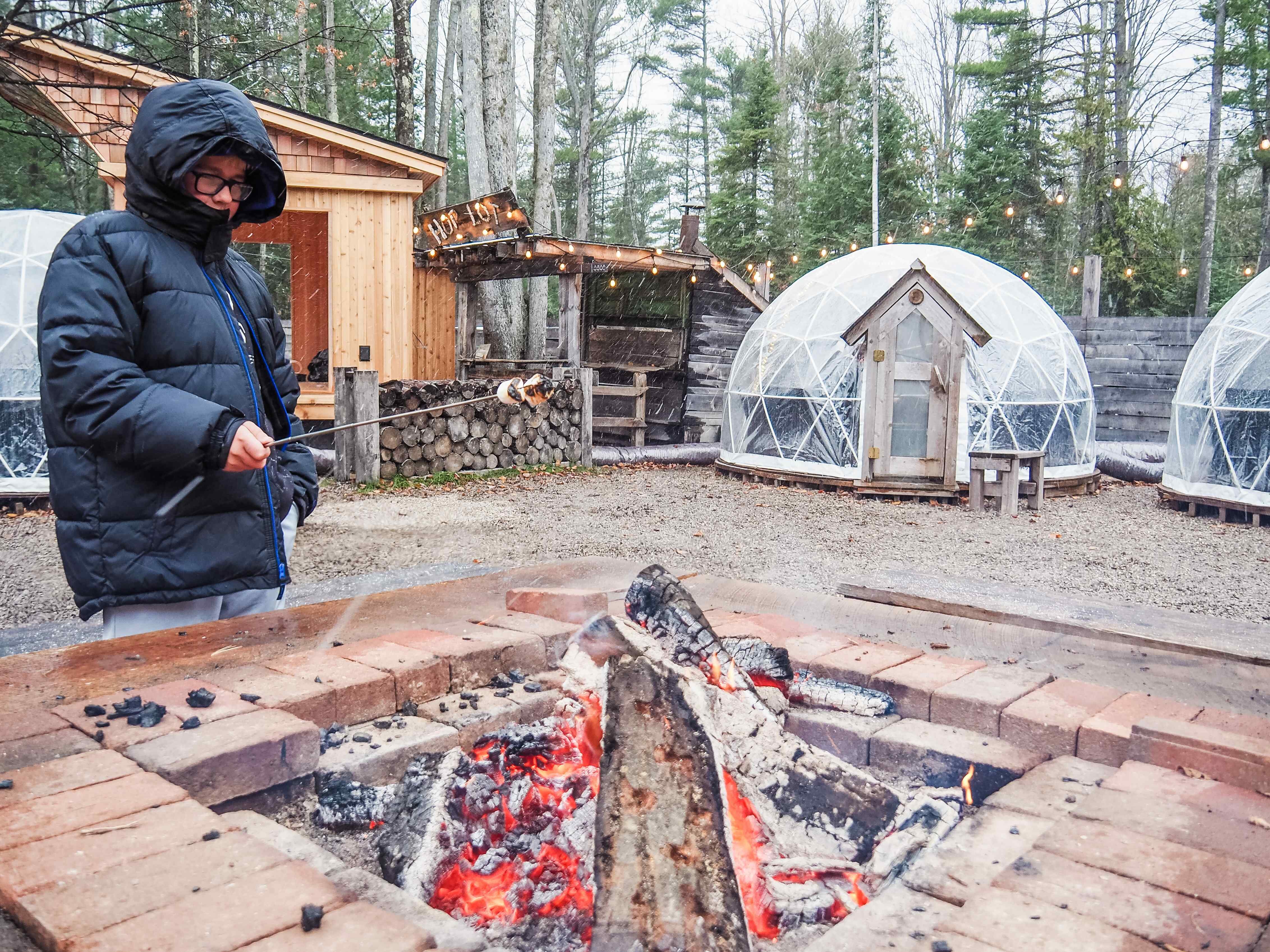 Standing around the campfire is a great way to warm up. 