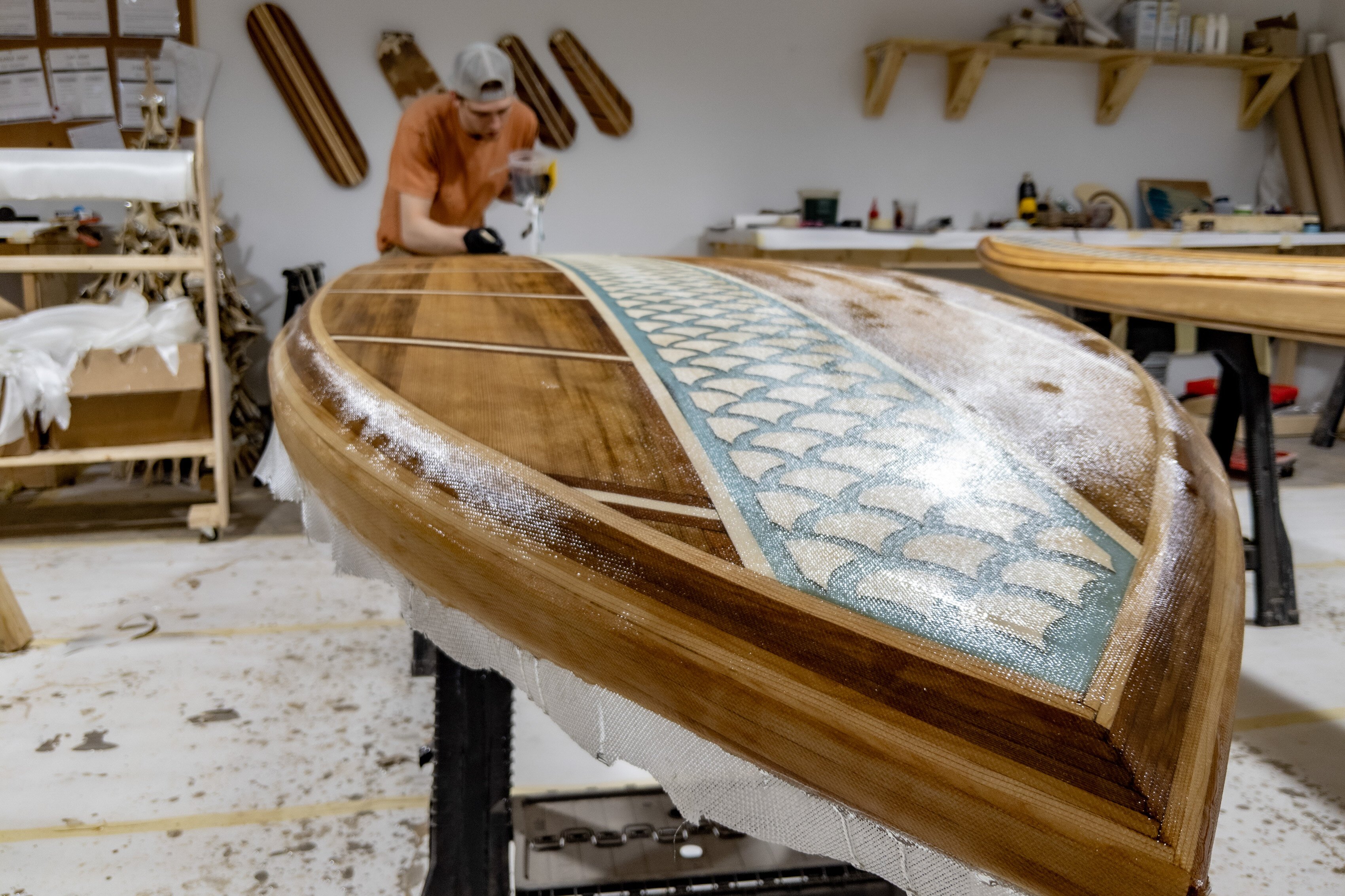 A paddleboard craftsman in action at Little Bay Boards.