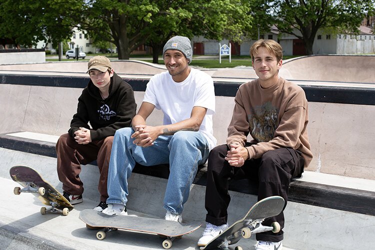 Cody Cepeda poses for a photo at Optimist Skatepark in Port Huron with fellow skateboarders Bryon Feiler (left) and Eric Cockream (right).