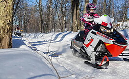 Snowmobilers enjoy an afternoon on Trail No. 417 in Marquette County.