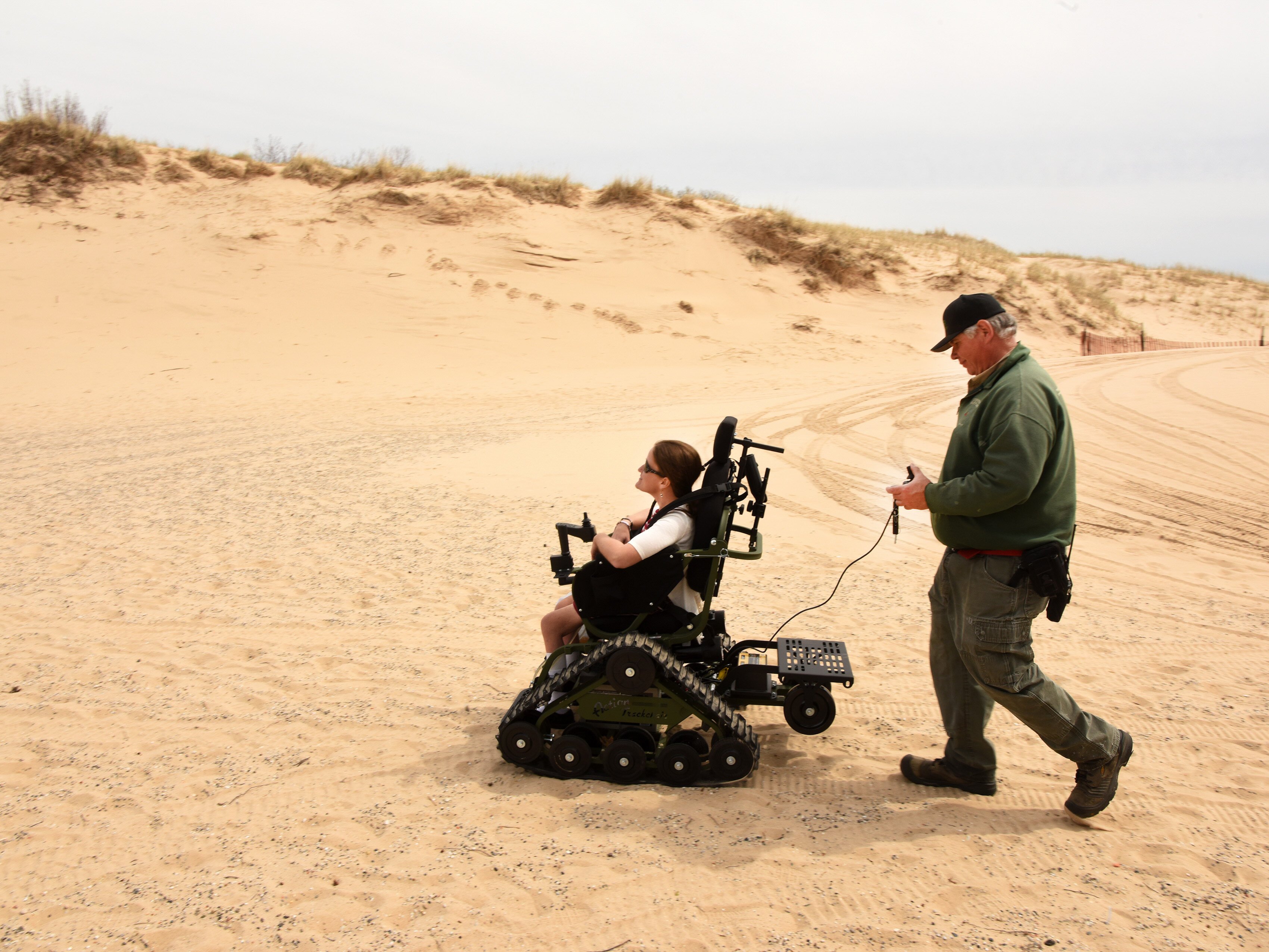 Jamie Spore explores the park's dunes on a track chair. 