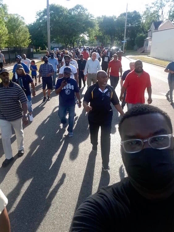 Men marched Tuesday evening, June 8, through Kalamazoo’s Northside neighborhood to call attention to the need for community members to stand against gun violence.