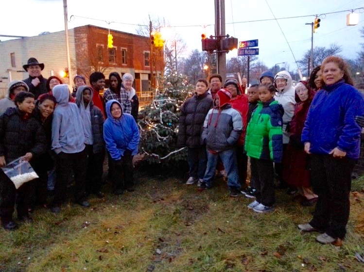 Lowder's Automotive donated a living tree to the Eastside neighborhood, which was decorated by CHAMPS and Peace House youth.