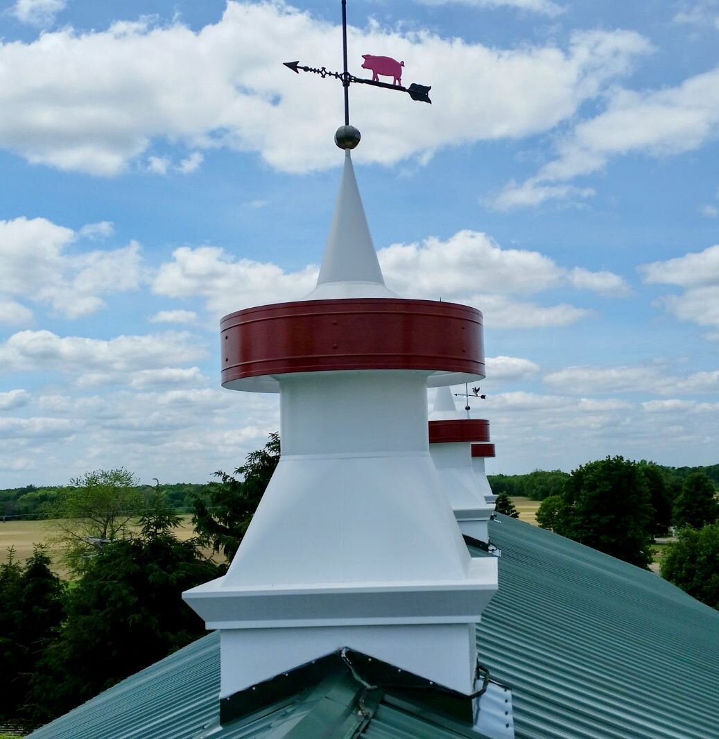 The ventilators on top of the barn  had to be rebuilt after a storm damaged them.