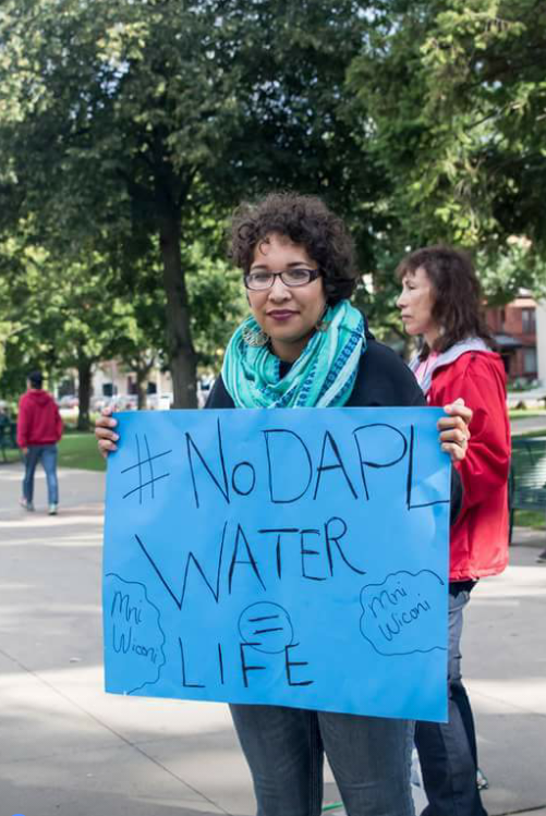 Monica Washington Padula with a No DAPL sign.