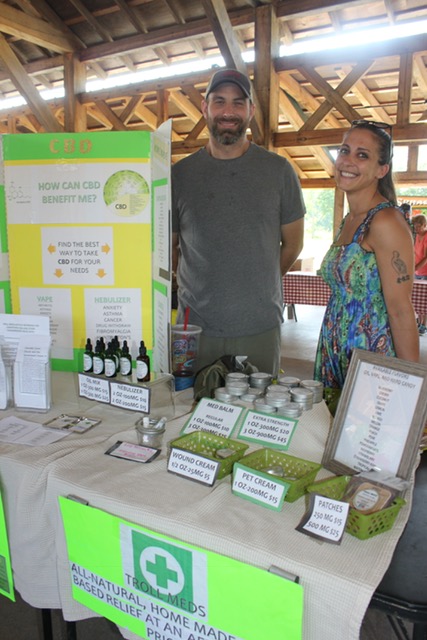 Trent Malling and Brook Green sell her CBD-infused salves and oils. Photo courtesy Sue Moore.