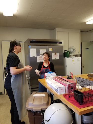 Volunteers discuss breakfast plans.