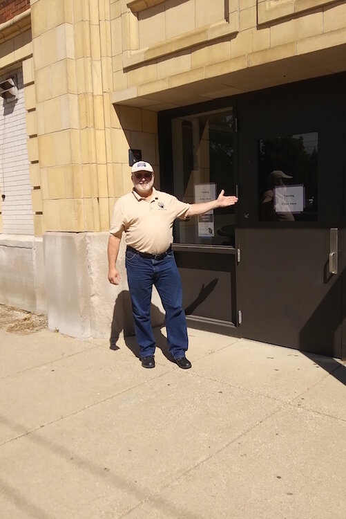 Mayor Dave Atchison outside the Albion College-Washington Gardner Gymnasium where testing will take place.