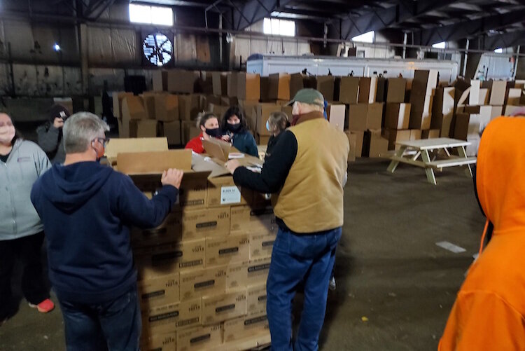 On Wednesday morning volunteers from churches throughout Battle Creek, including the Church of Jesus Christ of Latter-Day Saints, New Level Sports Ministries, unloaded and stacked a truckload of donated food for distribution over the coming weekend.