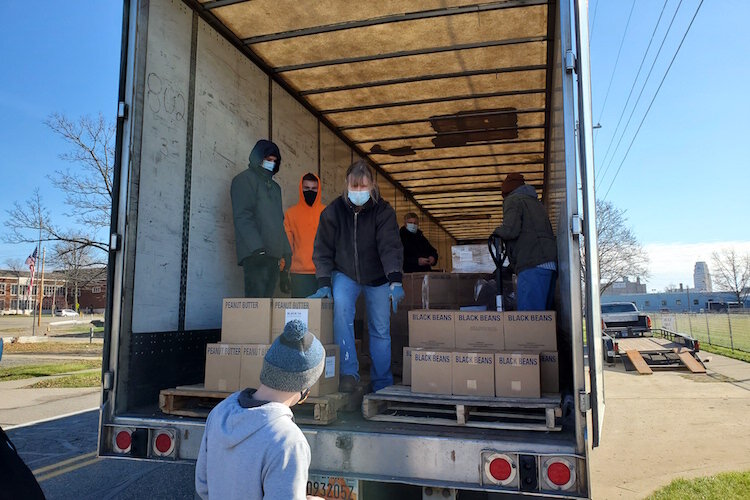 On Wednesday morning volunteers from churches throughout Battle Creek, including the Church of Jesus Christ of Latter-Day Saints, New Level Sports Ministries, unloaded and stacked a truckload of donated food for distribution over the coming weekend.