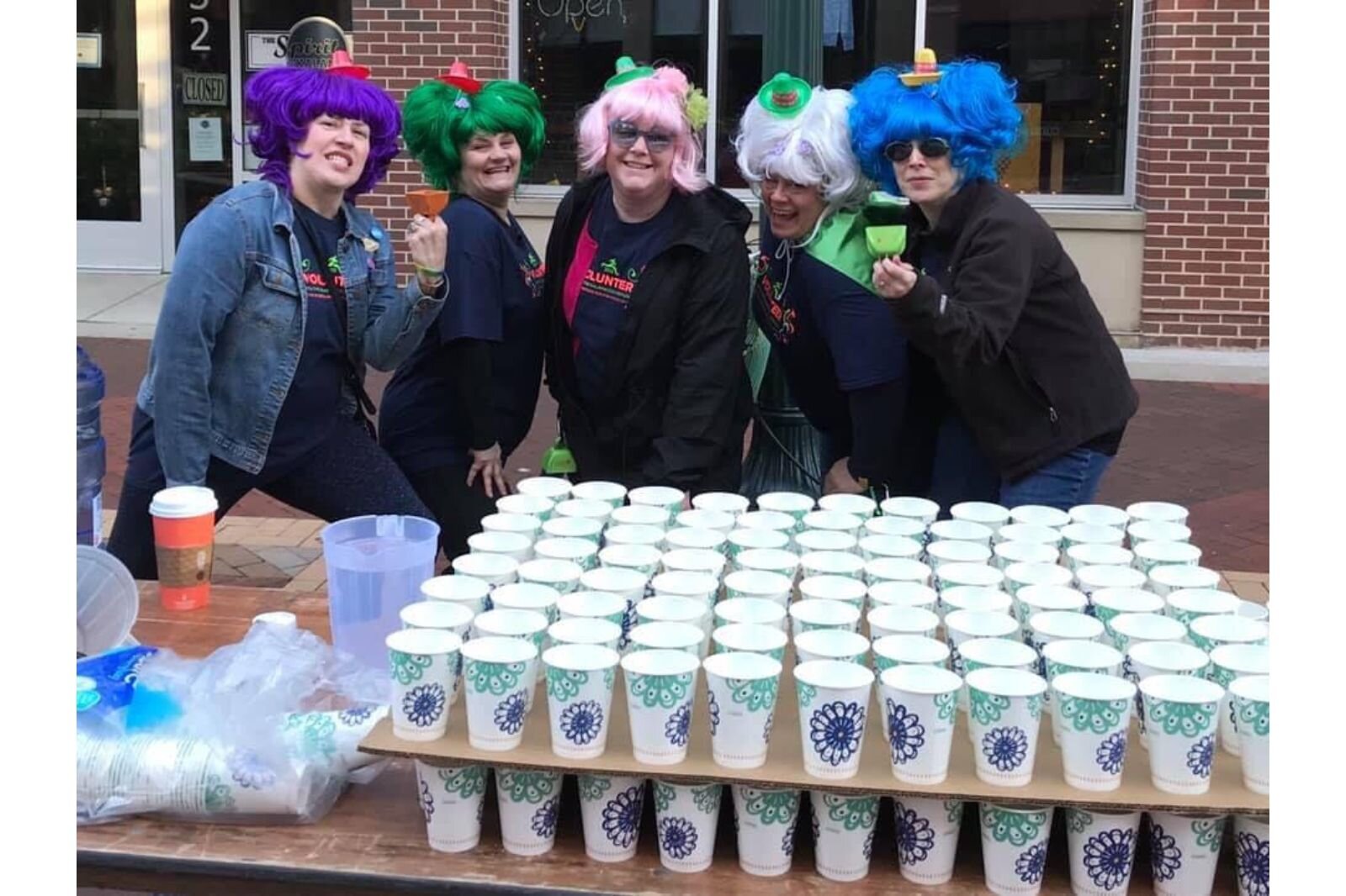 Jules Isenberg-Wedel, who has often brought out her wig collection for her and friends, to run the wiggiest Kalamazoo Marathon spirit station.