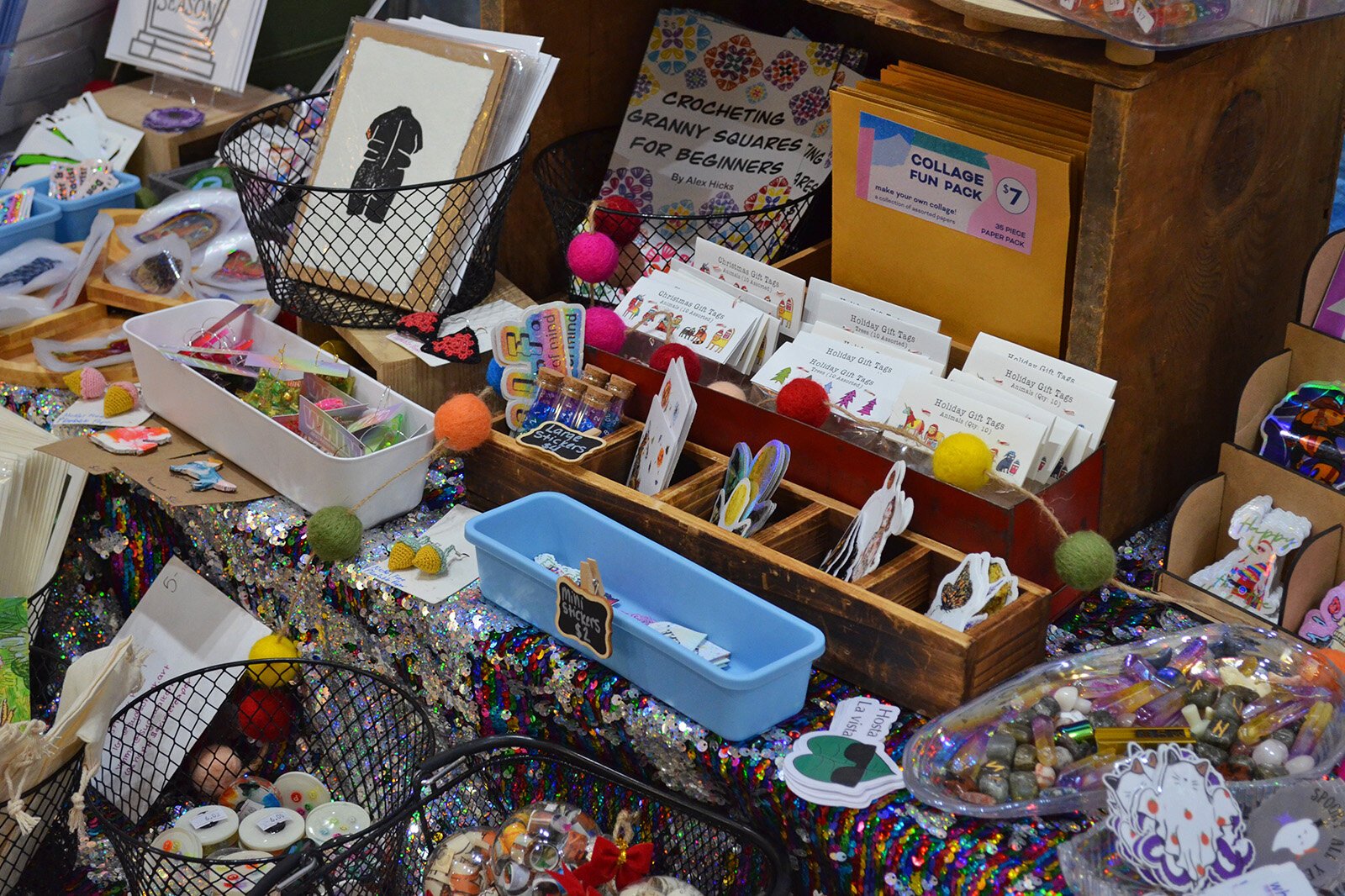 The tables inside Studio 209 were packed with glittering goods ready for bustling holiday shoppers. There were items of all different sizes and price points from prints, stickers, and buttons, to clothing, paintings, jewelry, and even furniture. 