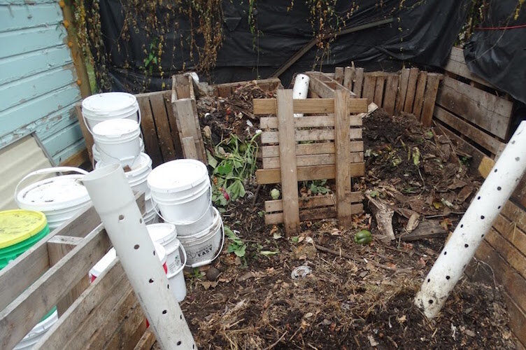  Residents of the VIne Neighborhood  were given the opportunity to participate in the composting service, care of The Bike Farm. They were given 5-gallon buckets like those seen at right on the lot where solid food waste is converted into compost.