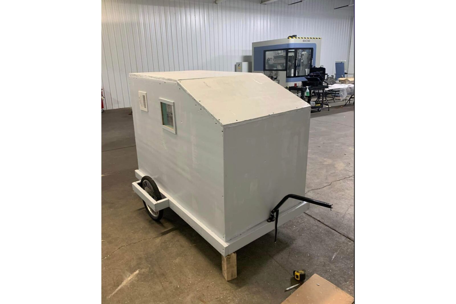 Dignity in Motion is building a bike camper prototype. With insulated walls, vents, windows and a solar charger, it could be towed by bike and used as emergency shelter.
