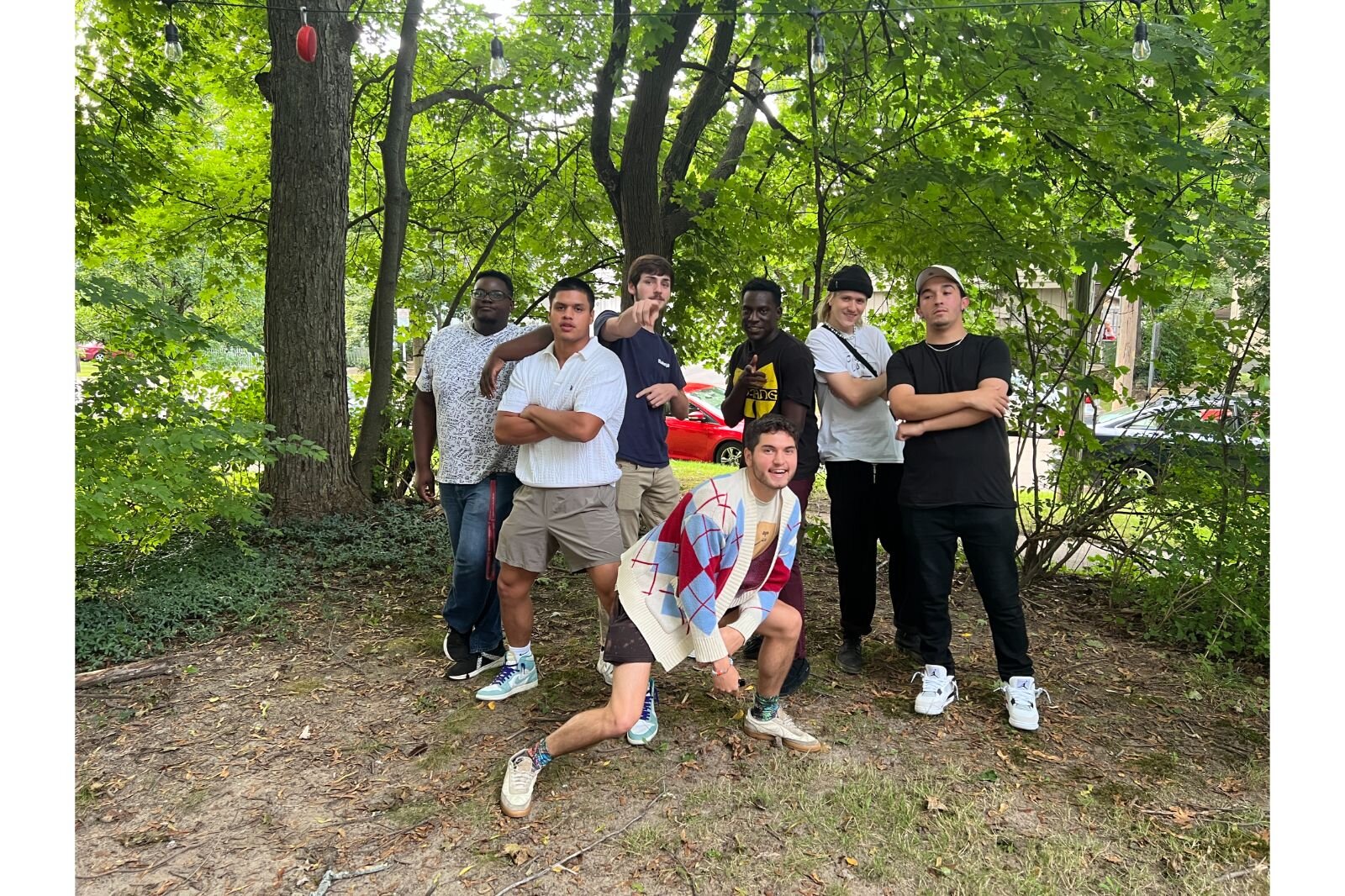 The group photographed outside of their Pioneer St. home base.