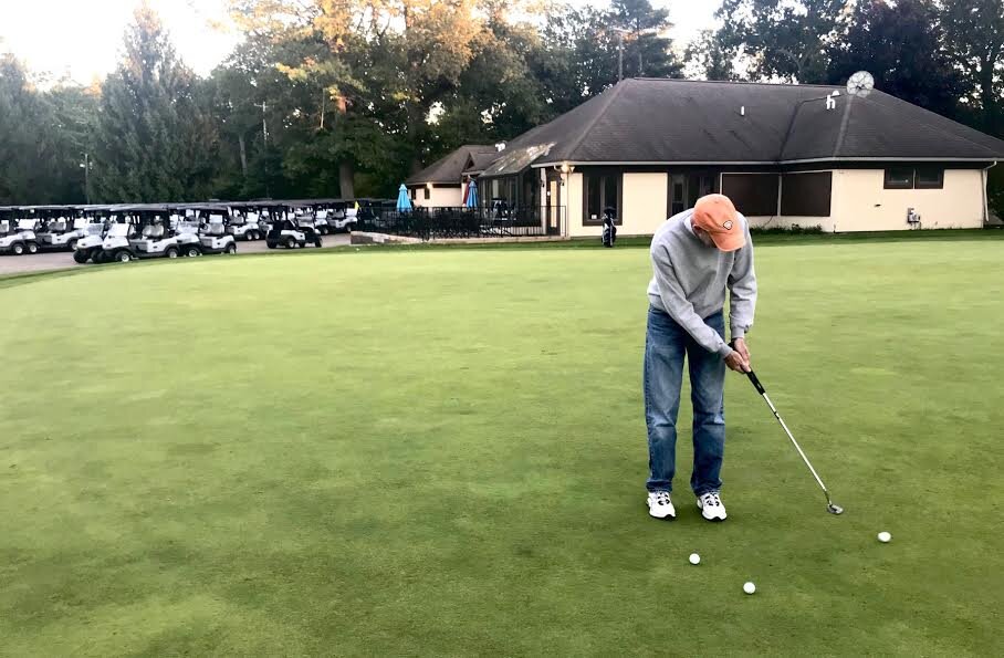 Owen Laughlin, who grew up in the Milwood Neighborhood, describes it as "a wonderful place to grow up." Now a retired special education teacher, is shown on the practice putting green at Milham Golf Course.