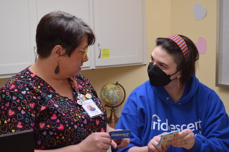 Love Chambers and Clinical Care Coordinator Christine Babcock in the reception area of Iridescent Health.