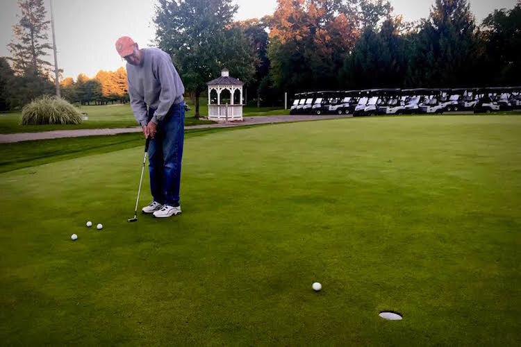 Owen Laughlin, who grew up in the Milwood Neighborhood, describes it as "a wonderful place to grow up." Now a retired special education teacher, is shown on the practice putting green at Milham Golf Course.